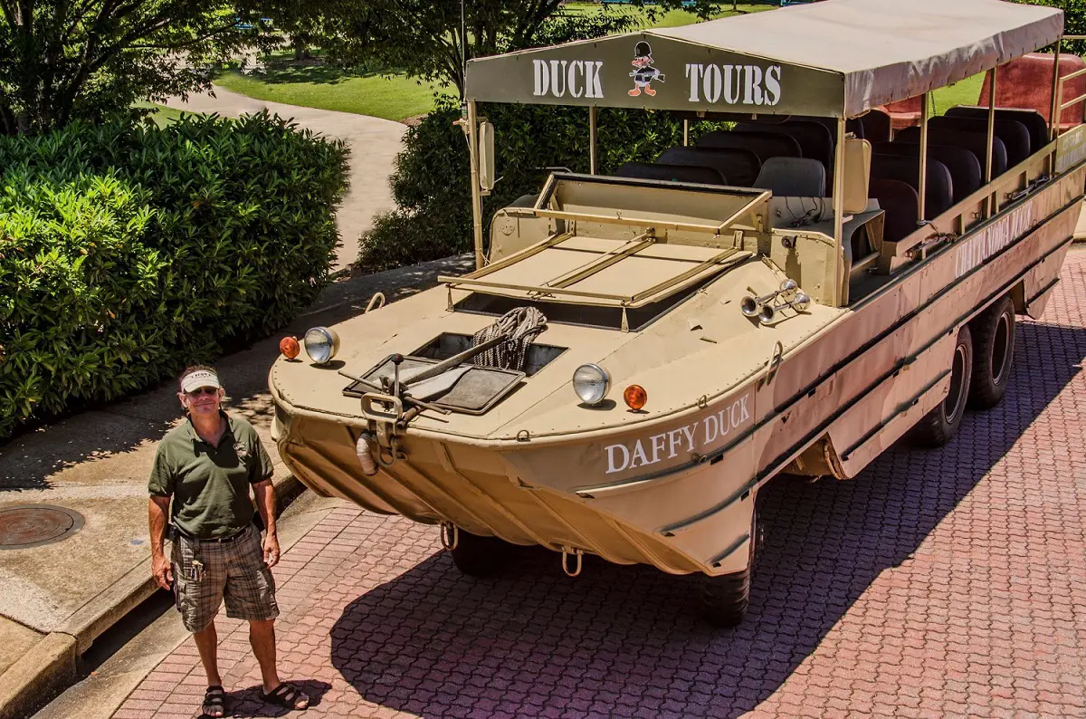 Chattanooga Duck Boat Tour owner Alex Moyers striking pose with the boat